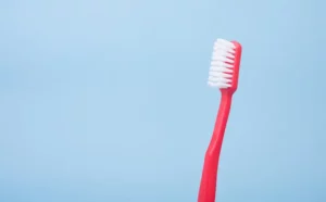 Smile Dental Clinic: Red brush on blue background for a healthy smile 
 800x496 Dentist Dr. Ana Fusu Dr. Fusu