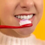 Smile Dental Clinic: Young lady brushing teeth for a healthy smile 800x533 Dentist Dr. Ana Fusu Dr. Fusu